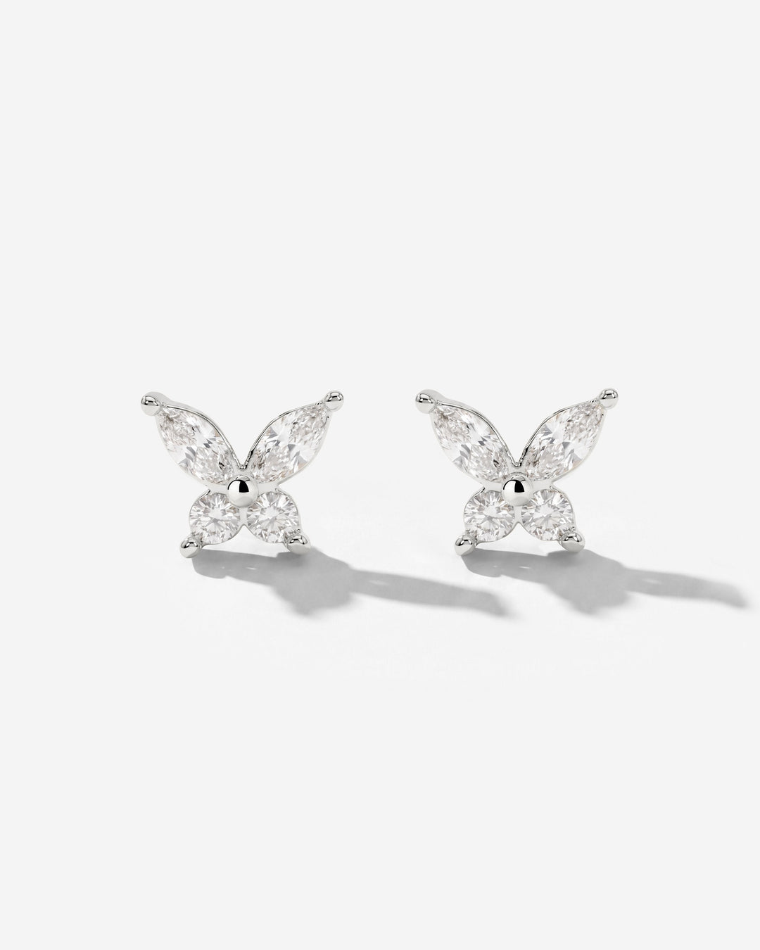Pair of silver-tone butterfly studs with clear stones, front view on a white background 4