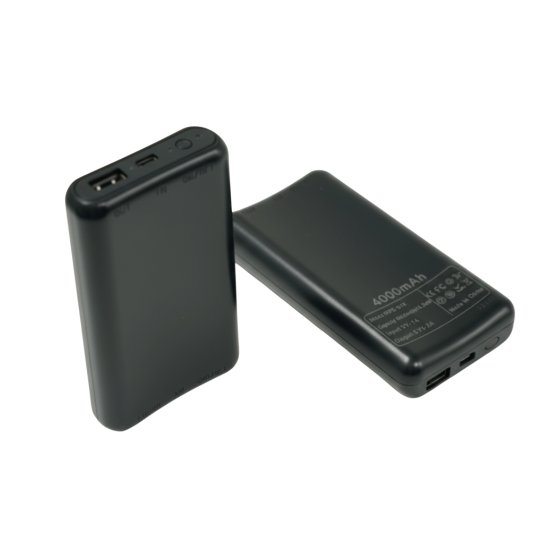Two black battery packs, one standing to show its USB port and one lying to show its label side 1