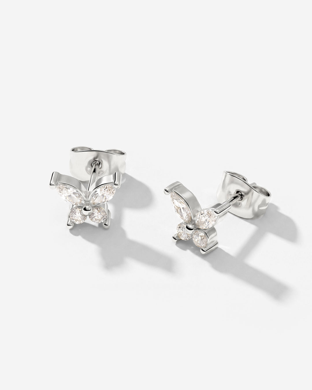 Silver-tone butterfly studs shown at an angle with posts and backs visible, set with clear stones 6