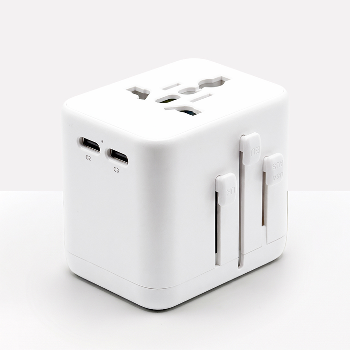 All-white adapter with two USB-C ports, the universal socket on top and three plug sliders 12