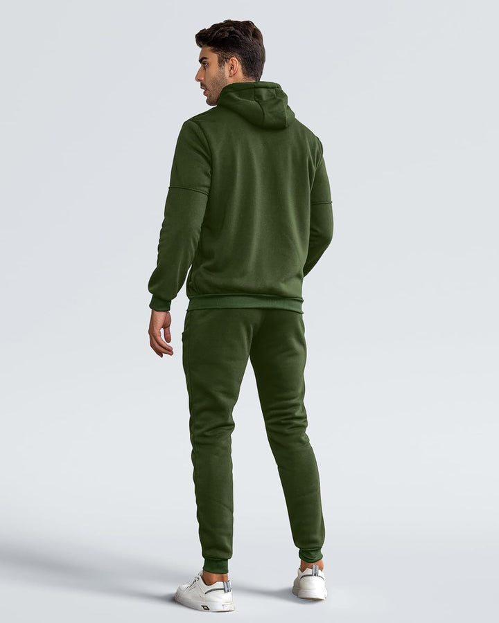 Back view of a man in an olive green hoodie and matching joggers 9