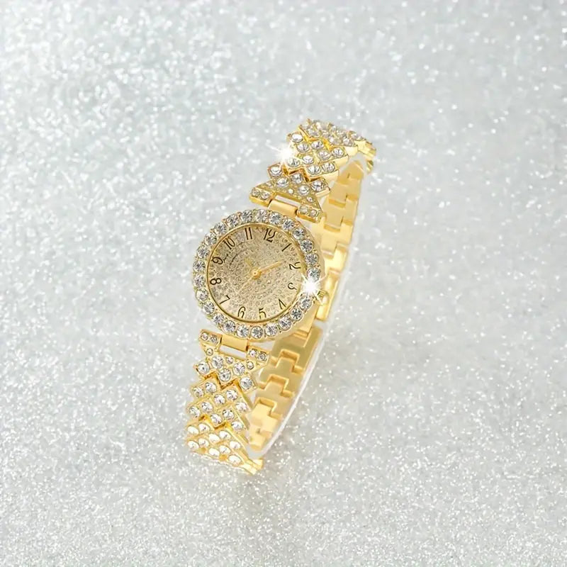 Gold crystal-studded watch with diamond-patterned band lying on a sparkling silver glitter surface 2