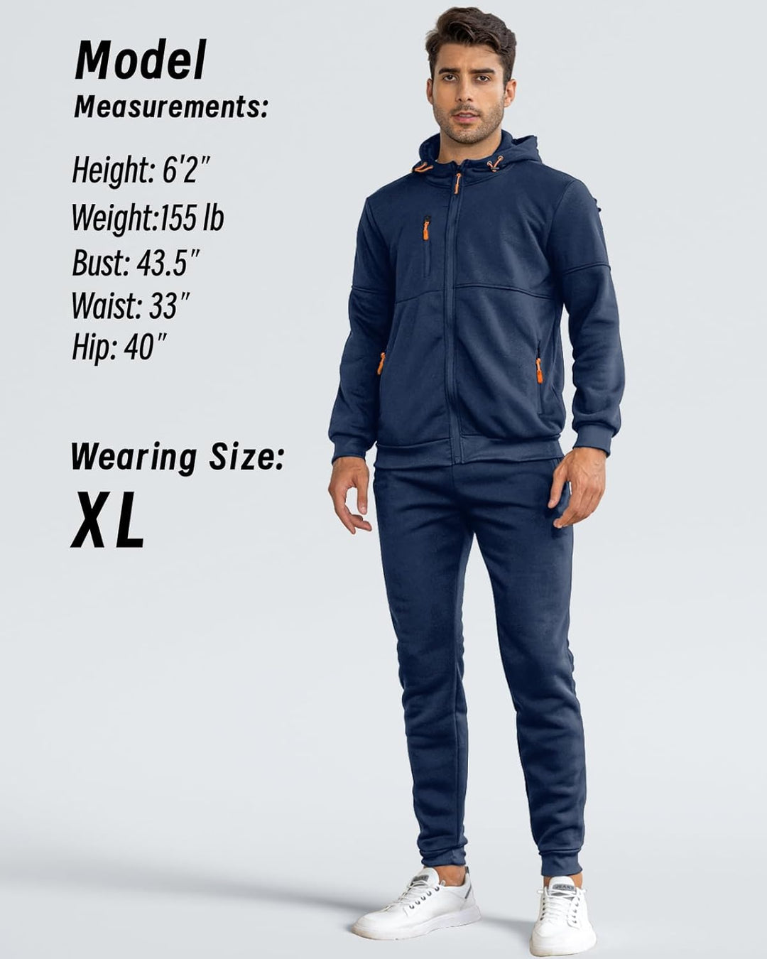 Model standing in the navy tracksuit, front view, with a measurements and wearing-size panel beside him 3