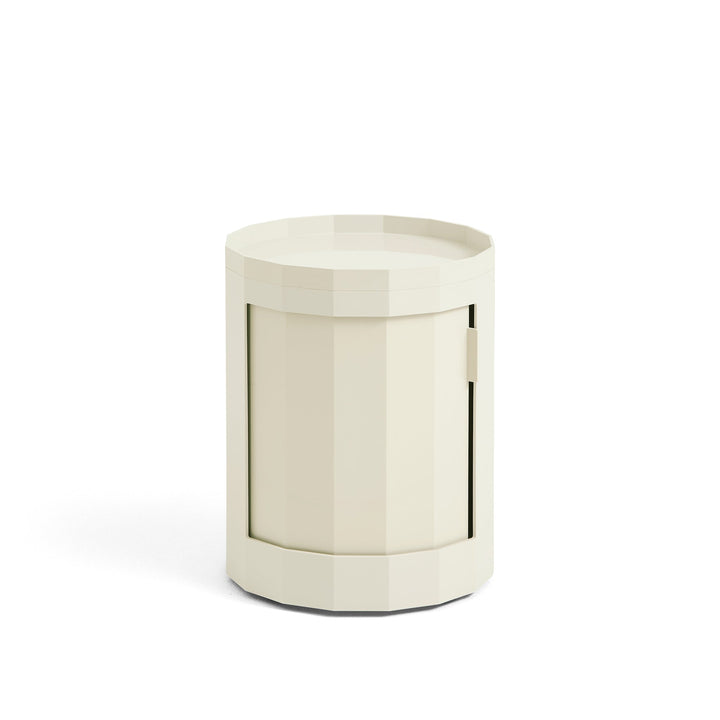 Short round cabinet in cream with closed door and raised tray top, shown on white 8