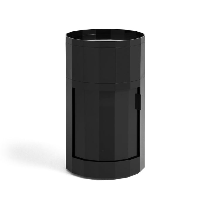 Tall round cabinet in glossy black with faceted sides, tray top and closed door on white background 4