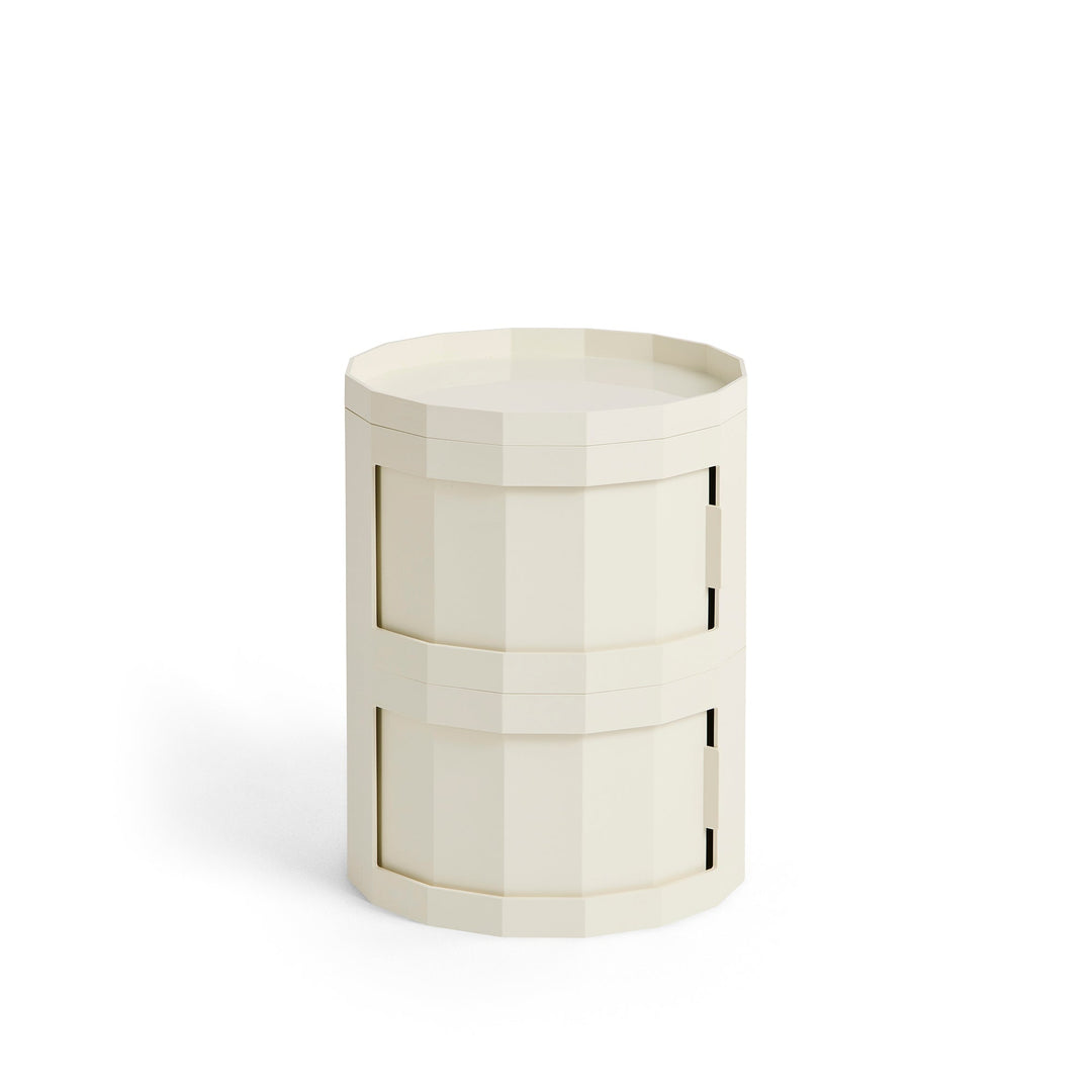 Compact two-door round cabinet in cream with a faceted body and tray top 30