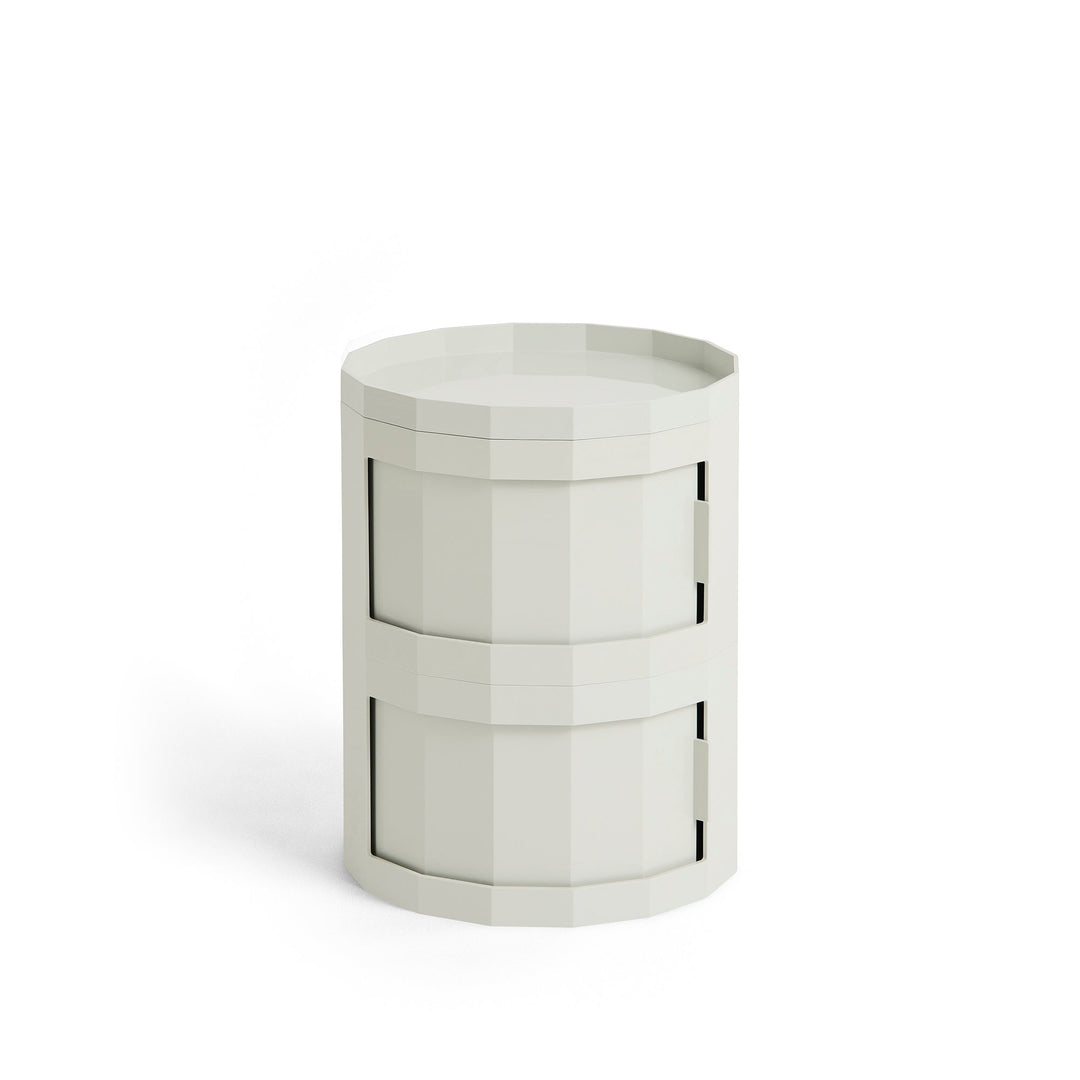 Compact two-door round cabinet in light gray with a faceted body and tray top 33