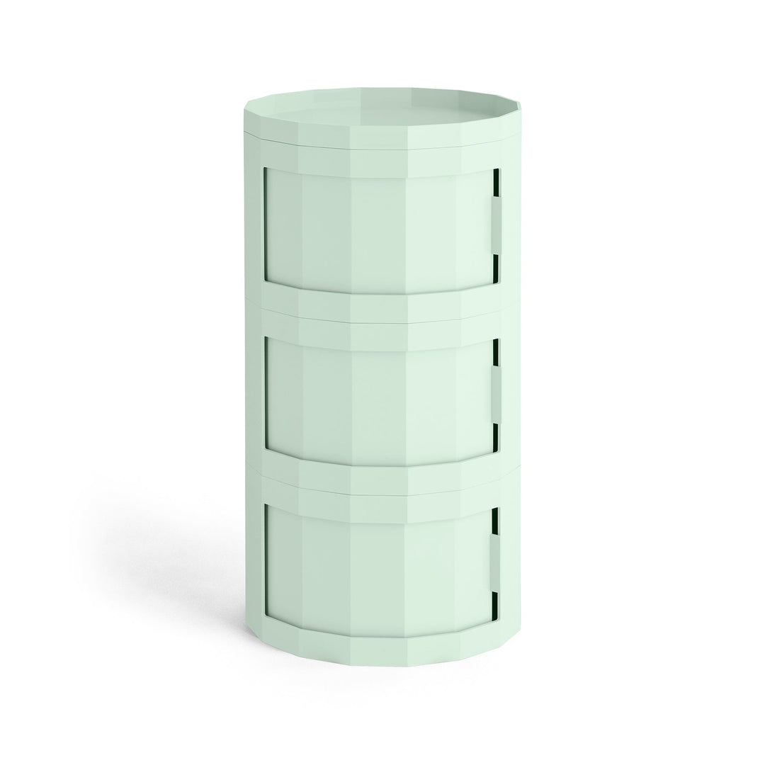 Front view of a pale mint green three-tier cylindrical cabinet with swivel doors and a rimmed top 42