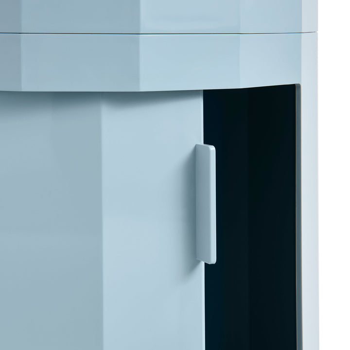 Close-up of a light blue swivel door handle, with the dark interior visible through the opening 44