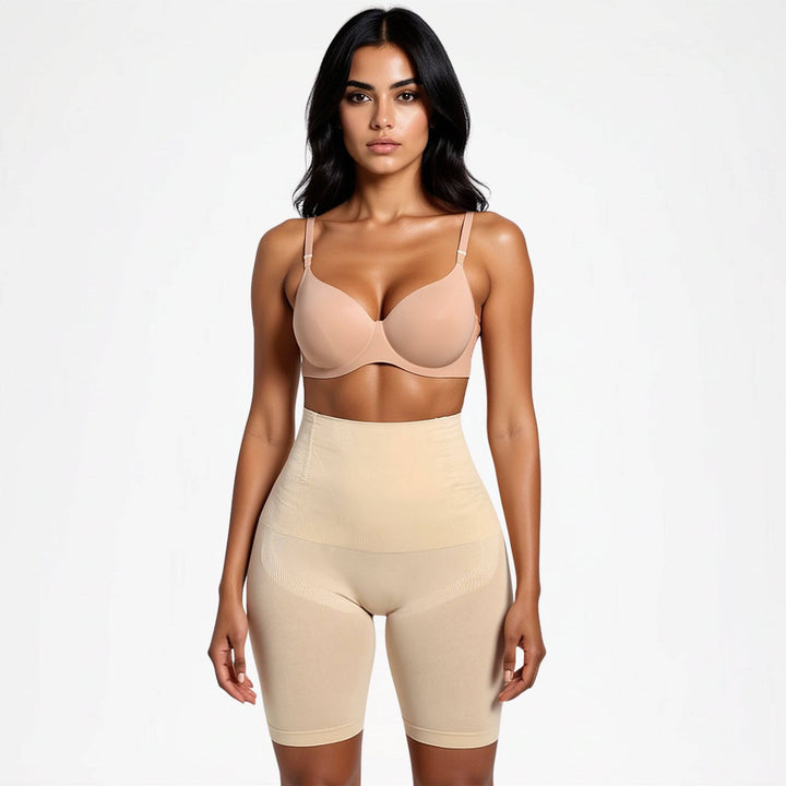 Front view of a model wearing beige high-waisted shaping shorts with a nude bra 9