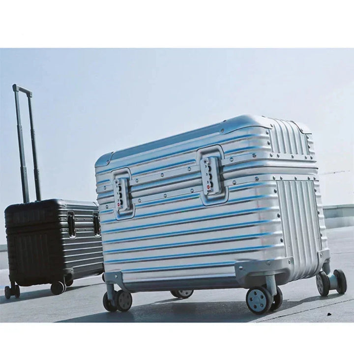 Silver ribbed spinner case in the foreground with a black one behind, outdoors on pavement 6