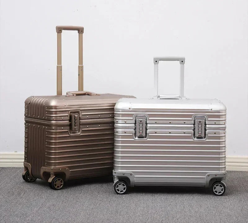 Champagne-gold and silver ribbed cases standing side by side with handles raised against a white wall 7