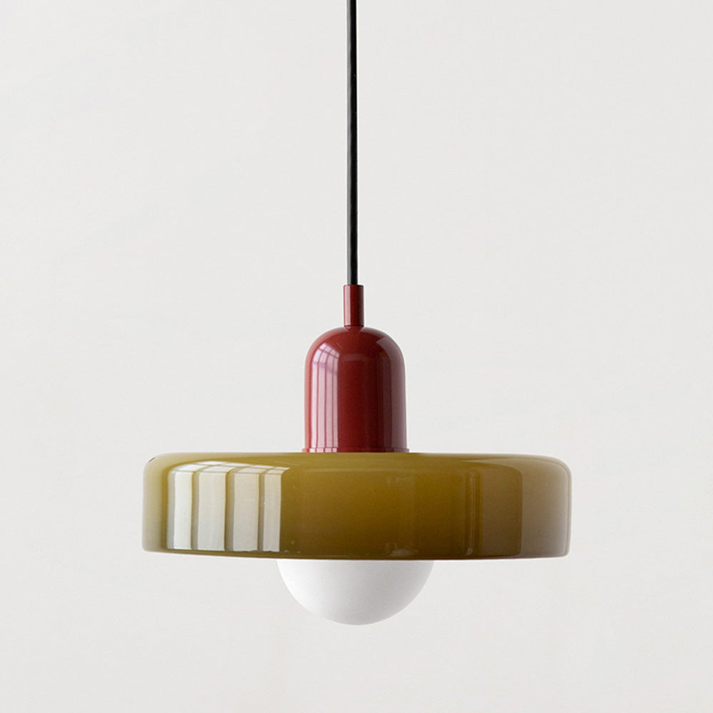 Olive glass disc pendant with a glossy red cap and round white bulb on plain background 2