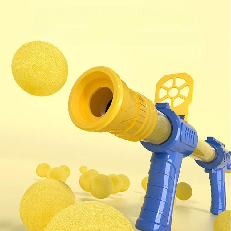 Close-up of the blue and yellow blaster barrel with soft yellow foam balls floating around it 4