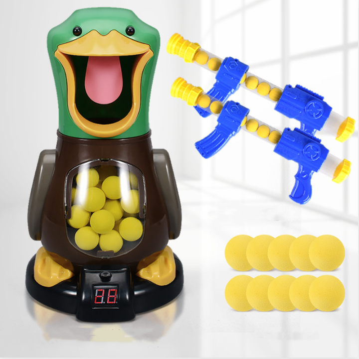 Duck target with score display, two blasters and ten loose yellow foam balls laid out together 6