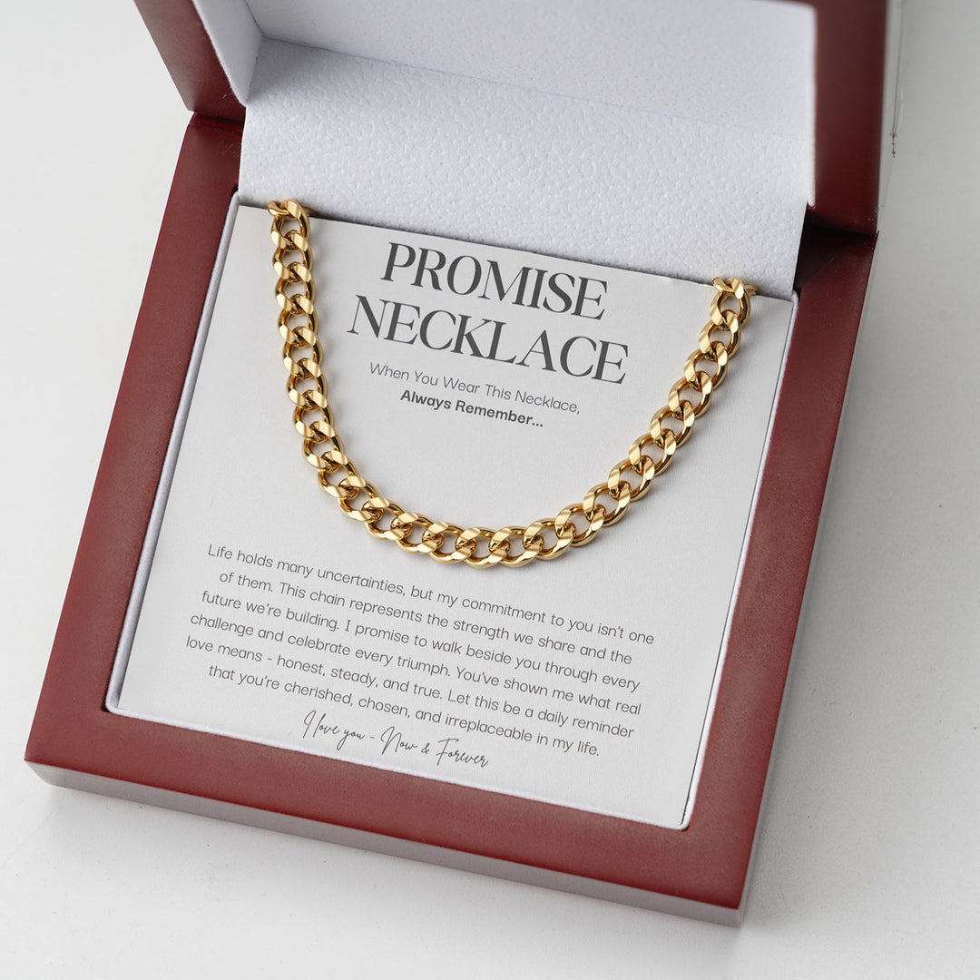 Gold-tone curb link chain displayed on a message card inside an open red wooden gift box 2