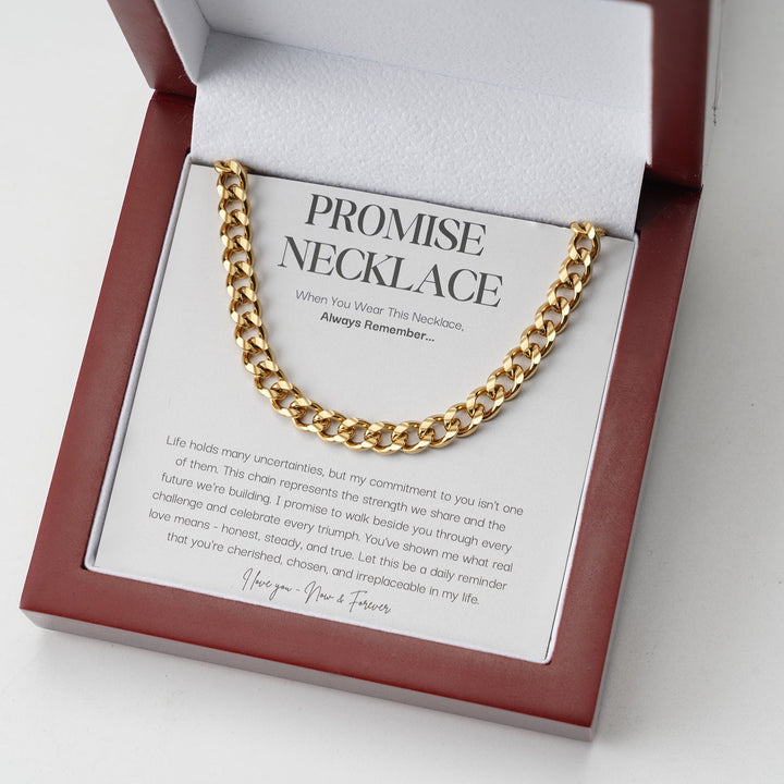 Gold-tone curb link chain displayed on a message card inside an open red wooden gift box 2