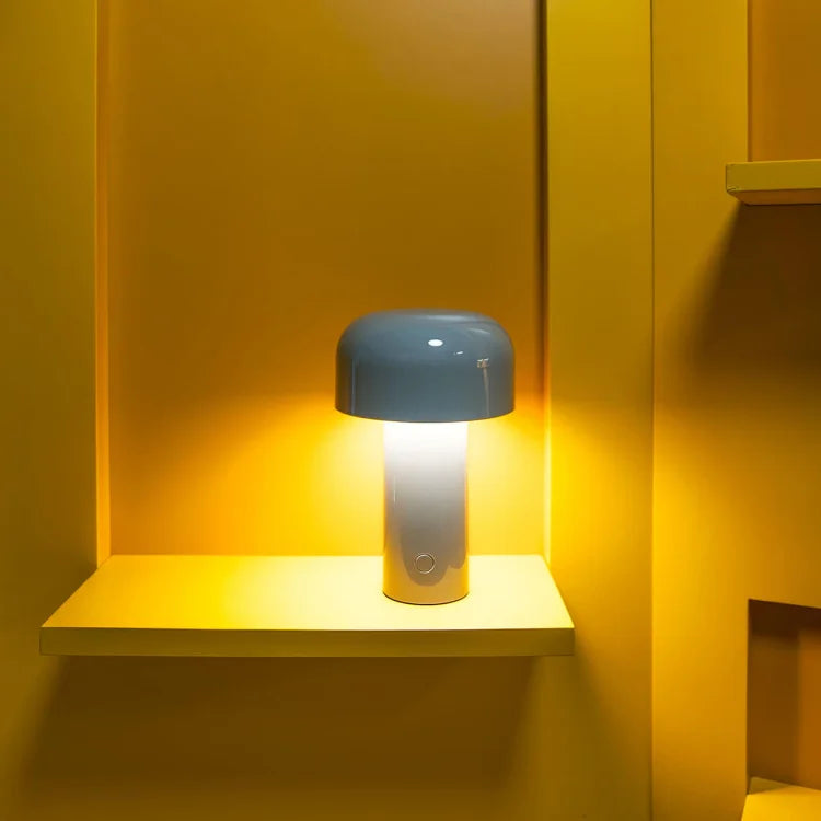 Lamp with blue-gray shade glowing on a small yellow shelf inside a yellow wall niche 12