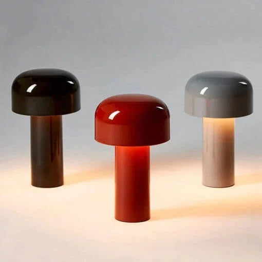 Three glossy lamps in dark brown, red and gray, glowing on a pale surface 26