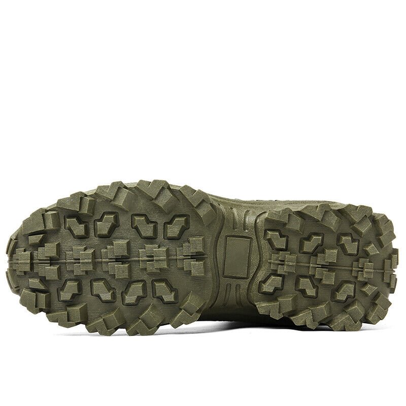 Close view of the olive green boot's outsole, showing deep blocky lugs and a flat center panel 22