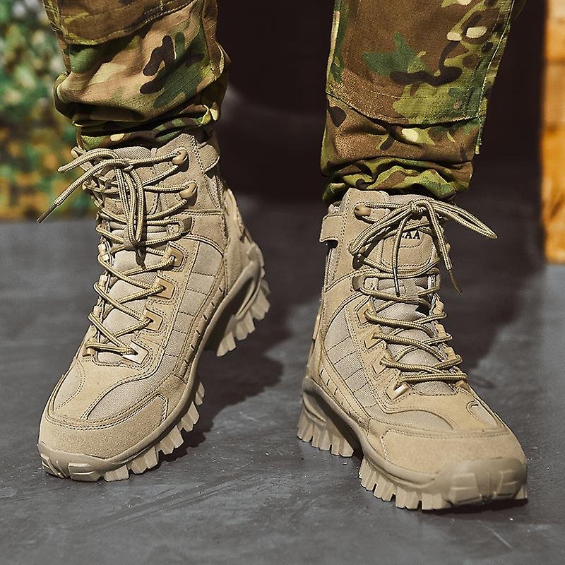 Front view of tan boots with tall laces and chunky lugged soles, worn with camo pants 3