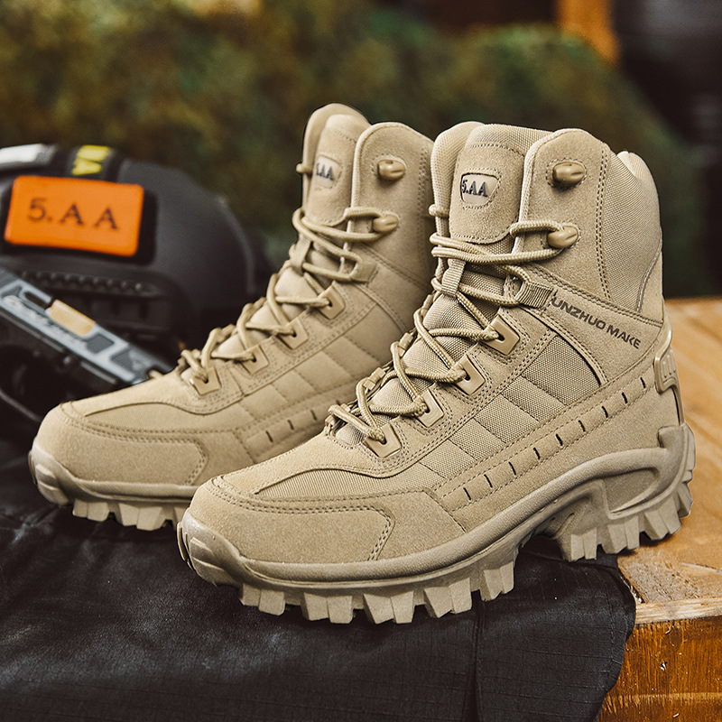 Pair of sand-colored suede and fabric high-top boots on dark fabric beside tactical gear outdoors 2