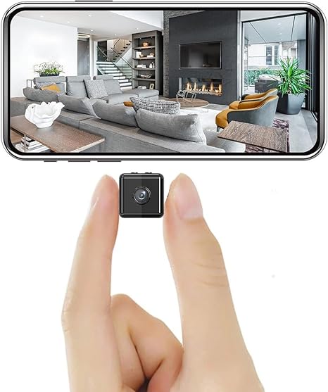 Small black camera pinched between fingers below a phone screen showing a live view of a living room 2