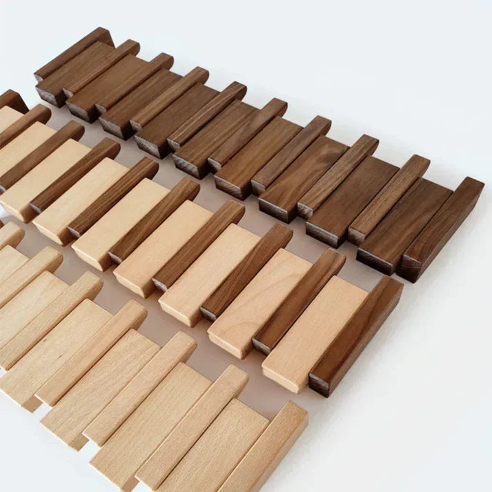 Flat lay of loose wooden slats in dark and light wood tones, arranged in rows 5